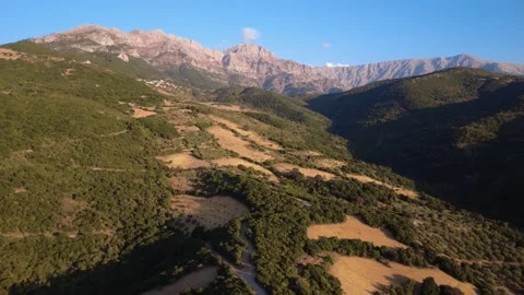 Rocky Mountain Range Above Forests Farmland and Remote Village in Greece Video stock 326935699