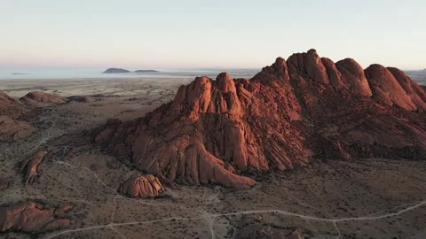Rocky Mountain Range in African Desert at Sunrise Stock Footage 300882582