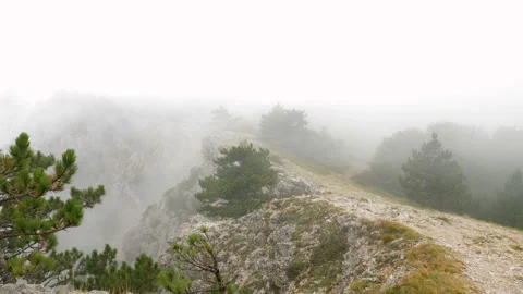 Rocky mountain range covered with clouds. Video stock 97747309