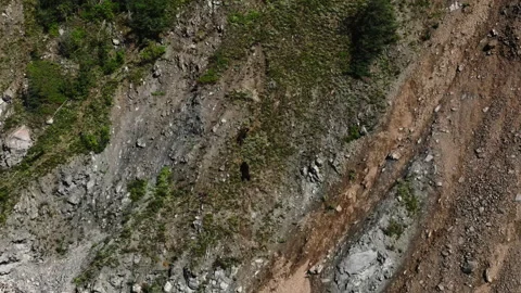 A rocky mountain range with a few rocks. Dangerous mountain Stock Footage 229548714