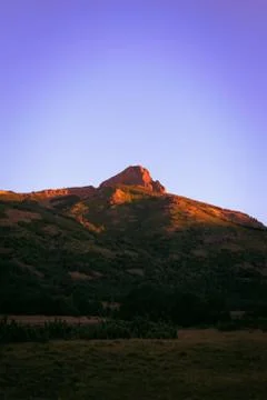 Rocky mountain receiving the first sunrays at dawn in Argentinian Patagonia Photos