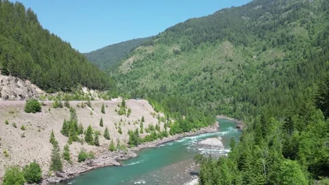 Rocky Mountain River Flowing Drone Shot Stock Footage 245392625