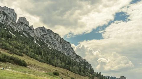 Rocky Mountain Slope Under Cloudy Sky Stock Photos