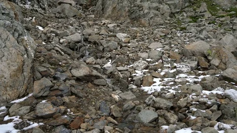 Rocky mountain with small waterfall Stock Footage 83007945