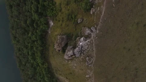 Rocky mountain stream at the green plain. Aerial shot. Ukraine Stock Footage 211807646