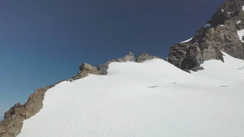 Rocky Mountain Surface Partially Covered with Snow in Switzerland Stock Footage 126356580