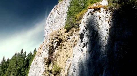 Rocky mountain with tree and dark sky Stock Footage 50098665