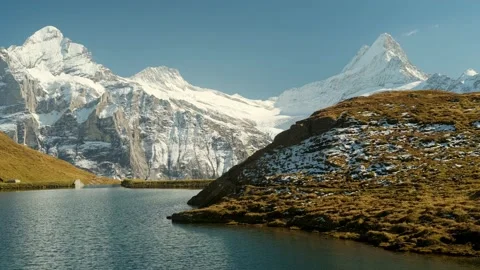 Rocky mountains and reflection on the surface of the  Bachalpsee lake. Video stock 201164947