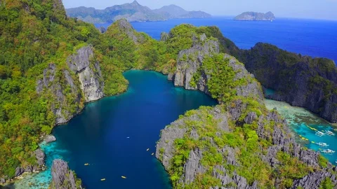 Rocky mountains with big lagoon on background turquoise ocean in El Nido Stock Footage 107974662