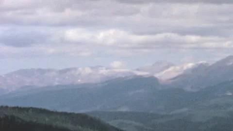 Rocky Mountains Landscape With Coniferous Trees And Snow Peaks Colorado 1960s 動画素材 347123914