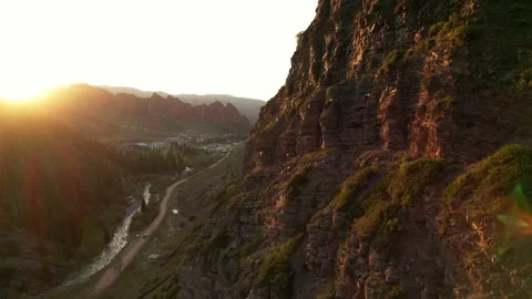 Rocky mountains in the rays of sunset, aerial view. Beautiful untouched nature Stock Footage 273677079