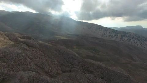 Rocky mountains span across wild highlands - Mountain Ridge and Geology Texture Stock Footage 339643845
