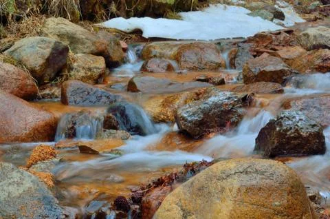 Rocky mountains stream Stock Photos