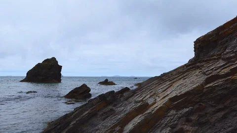 Rocky ocean coast on a cloudy day. Stock Footage 106449089