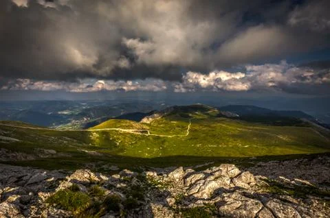 Rocky path and grassy rax plateau along Waxriegel in the cloudy sunset Stock Photos