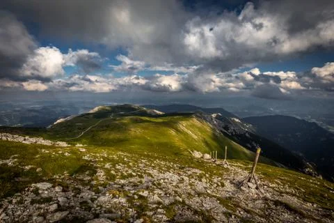 Rocky path and grassy rax plateau on hike Dambocksteig from Schneeberg Stock Photos