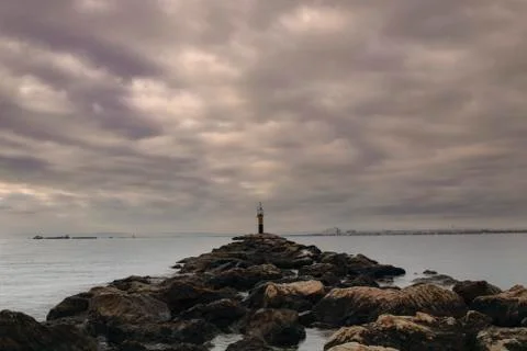 Rocky path to the light house Stock Photos