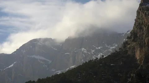 Rocky peak rising through clouds on snowy high mountain - Blanca Peak and Range Video stock 339375478
