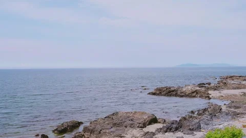 Rocky reef coast and endless ocean horizon in Saganoseki, Oita Vídeos de archivo 337073165
