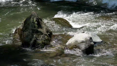 Rocky river cascade with fast and clear water flow 動画素材 297656722