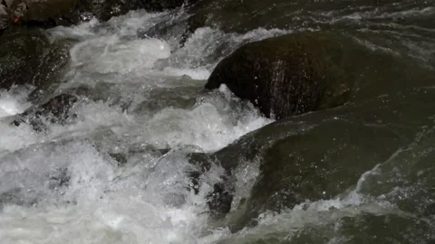 A rocky river flow that still looks natural in the countryside Stock-Footage 287994396