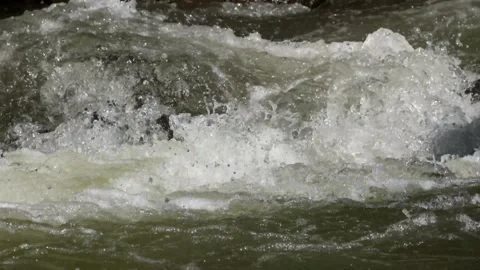 A rocky river flow that still looks natural in the countryside Stock Footage 287994653