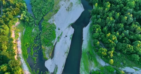 A rocky river in the middle of a forest in 4K. Aerial view of tranquil river  Stock Footage 198022710