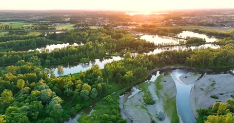 A rocky river in the middle of a forest in 4K. Aerial view of tranquil river  Stock Footage 198029673