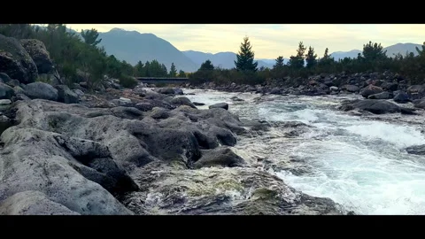 Rocky River With Snowcapped Mountains Background Vidéo 345663536