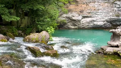 A rocky river with trees in the background Video stock 255724161