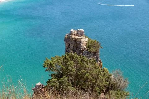 Rocky Sea Stack Above the Atlantic in Nazare, Portugaln Stock Photos