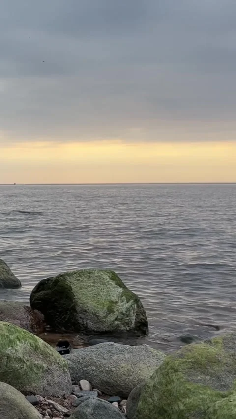 Rocky Seaside at Cloudy Evening – 4K Stock Footage 320370500