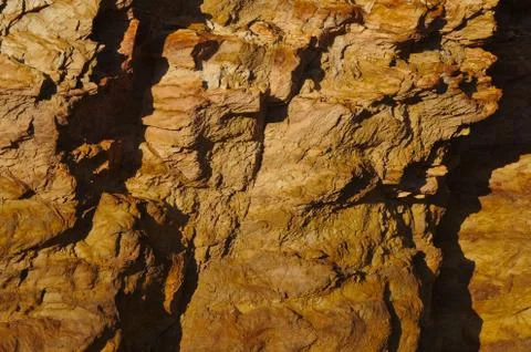 Rocky shadows and texture Stock Photos