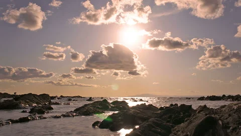 Rocky Shore and the Reflection of the Sunset Stock Footage 327540800