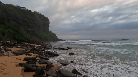 Rocky shore with cloudy sky Stock Footage 212526098