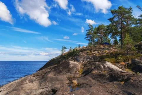 Rocky shore of the lake. Stock Photos