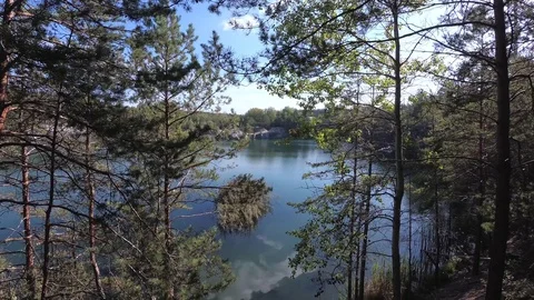 Rocky Shore of the Lake, Reflection of Clouds in the Water Stock Footage 98926434