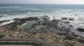 Rocky shore of the ocean seen from the wooden promenade, Porto 4k or 4k+ Resolution