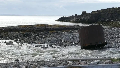 Rocky shore, a rushing river flows into the bay. Stock Footage 81727046