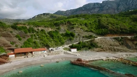 Rocky Shore In The Sea With Forest. Footage. Aerial Stock Footage