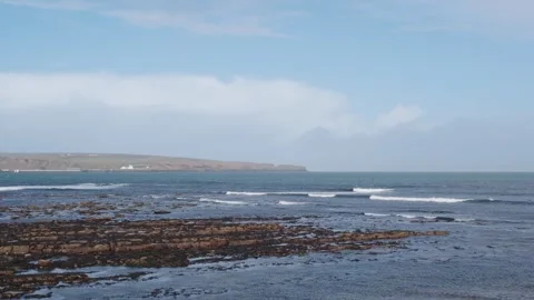 Rocky Shore at Thurso with Waves Breaking on a Spring Day Stock Footage 332069682