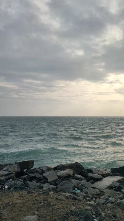 Rocky shore with waves in bright day light Stock Footage 277994496