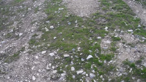 Rocky slope of a small mountain with some boulders. Video stock 142095274