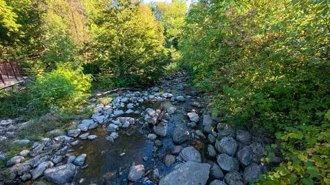 A rocky stream flows through Toronto Botanical Garden Stock Photos