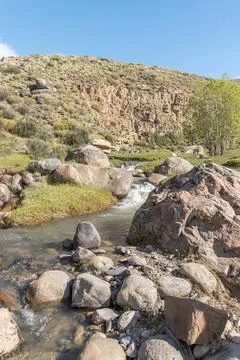 A rocky stream with a small waterfall Stock Photos