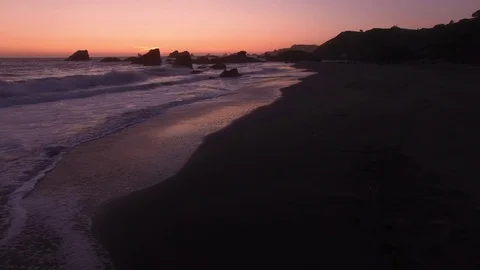 Rocky sunset waves Stock Footage 70332977