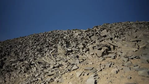 Rocky surface with cracks and blue sky Stock Footage 318622977