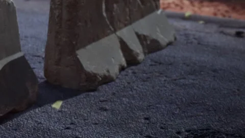 Rocky Terrain Meets Smooth Surface Under a Bright Sun in an Outdoor Setting Stock Footage 344910289