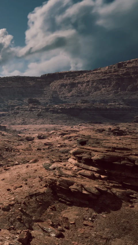 Rocky terrain under a blue sky with thin clouds during daylight Stock Footage 339039724