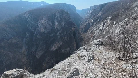 Rocky trail winds through barren hillsides. Balkan, Eastern Europe, POV Video stock 331452979